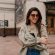 adorable-lady-with-long-dark-hair-wearing-denim-jacket-posing-old-buildings-city-centre_291650-997